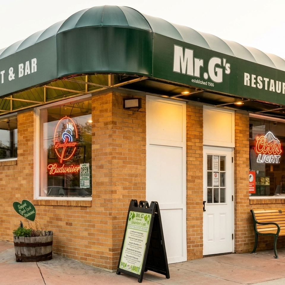 Exterior of Mr. G’s Restaurant & Bar, featuring a green awning, brick walls, neon beer signs, entrance, and sidewalk bench.